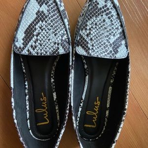 Pointed toe snakeskin flats